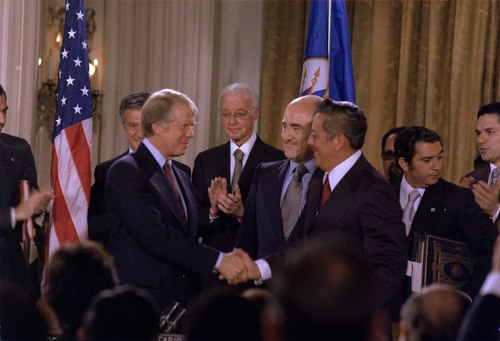 President Jimmy Carter shaking hands with Torrijos after signing the Panama Canal Treaty in 1977.