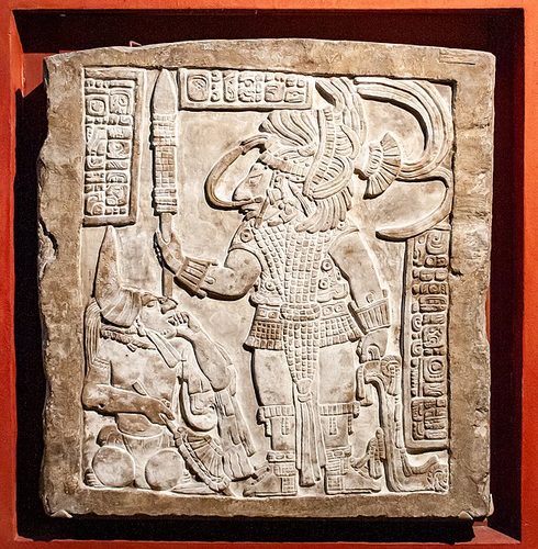 A stone-carving depicting a Maya bloodletting ritual. 
